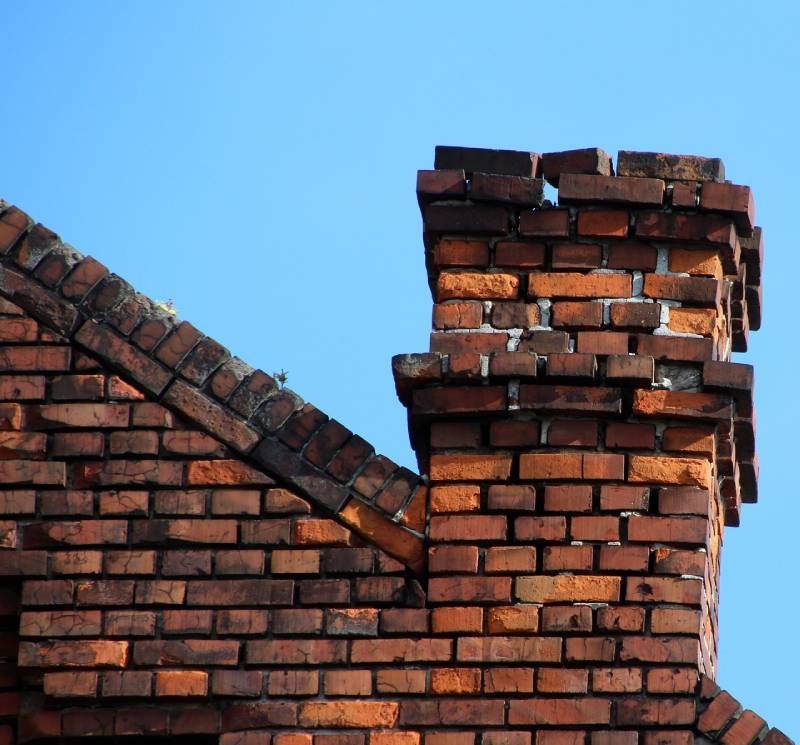 Signs Your Coconut Creek Home Needs a Chimney Inspection Damaged chimney on an Coconut Creek home showing cracks and missing mortar